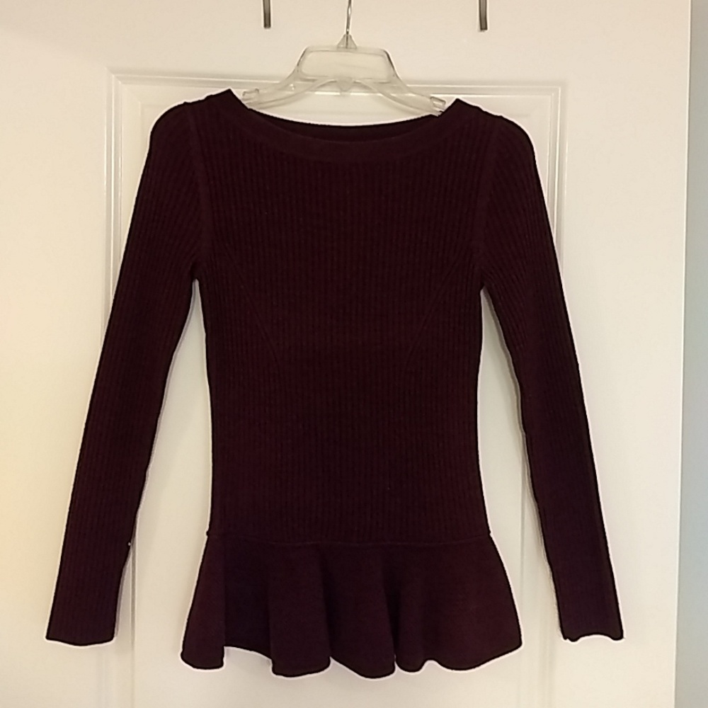 Ribbed sweater with flirty peplum base